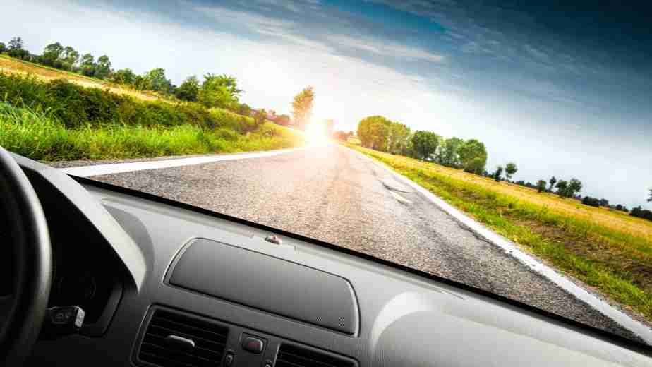 Car driving in the sunset